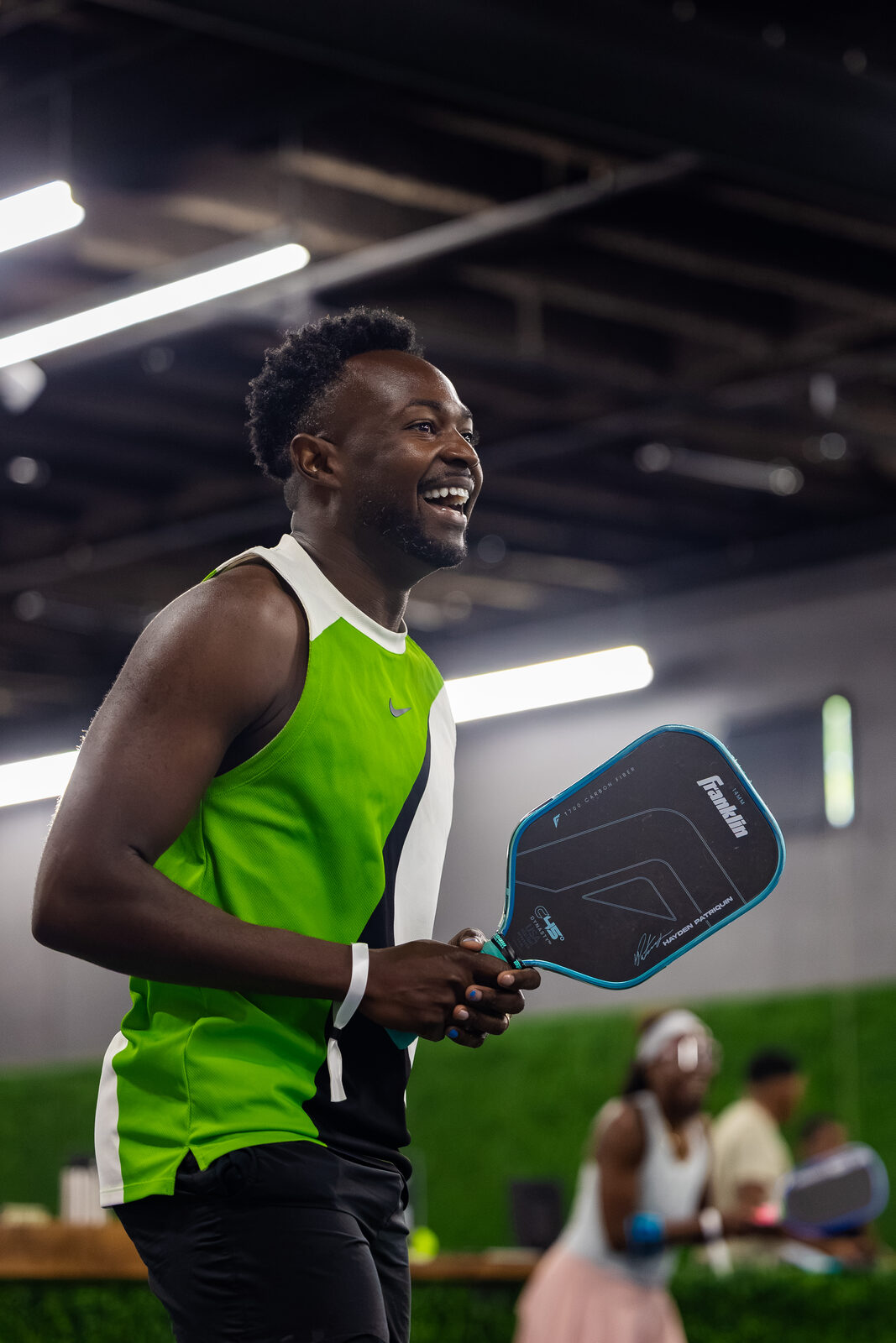 A player laughing courtside