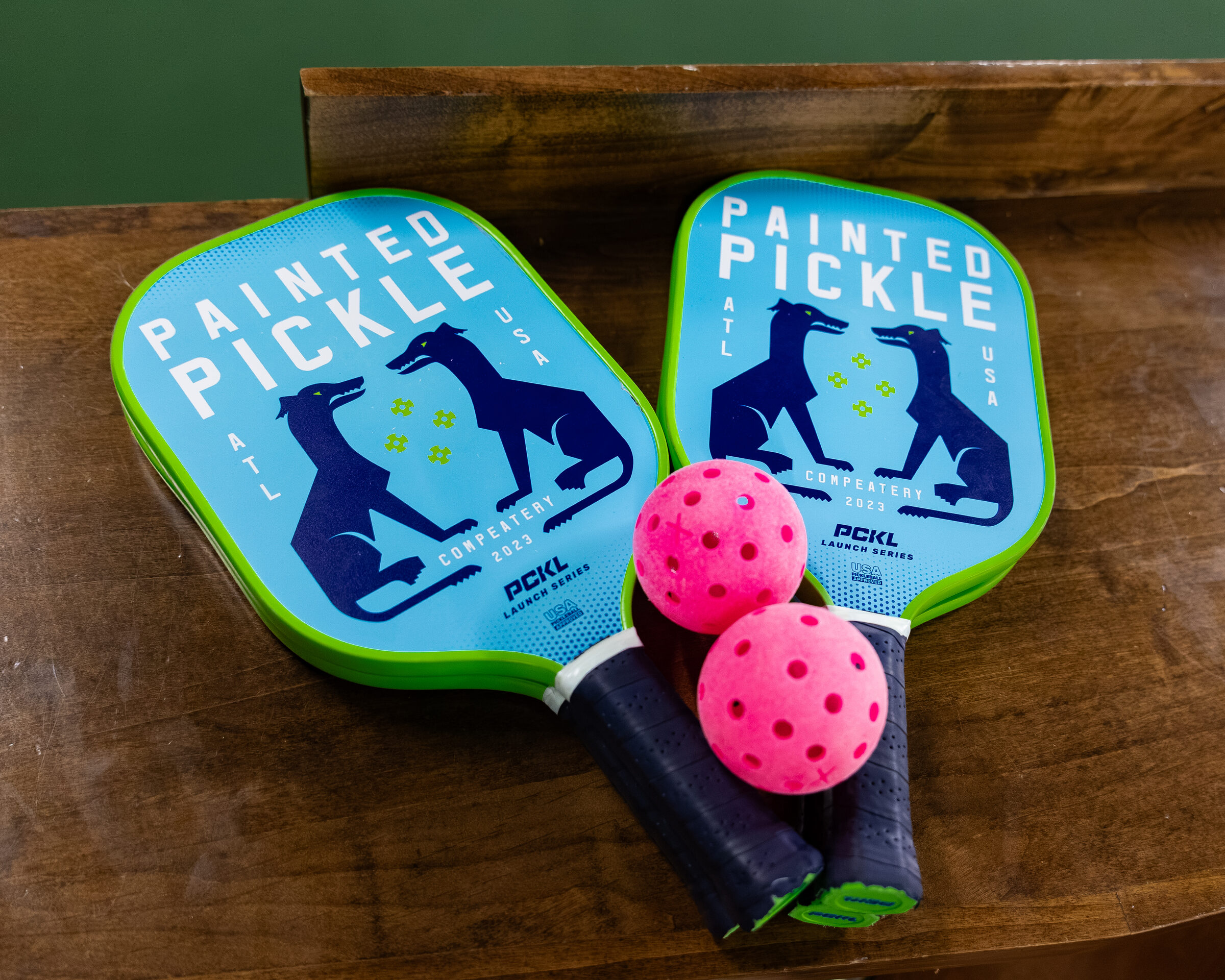 Paddles and balls laid out on a table